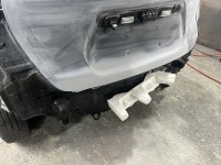 ノートのバックドア/リアバンパー凹みを部品購入無し板金塗装で修理